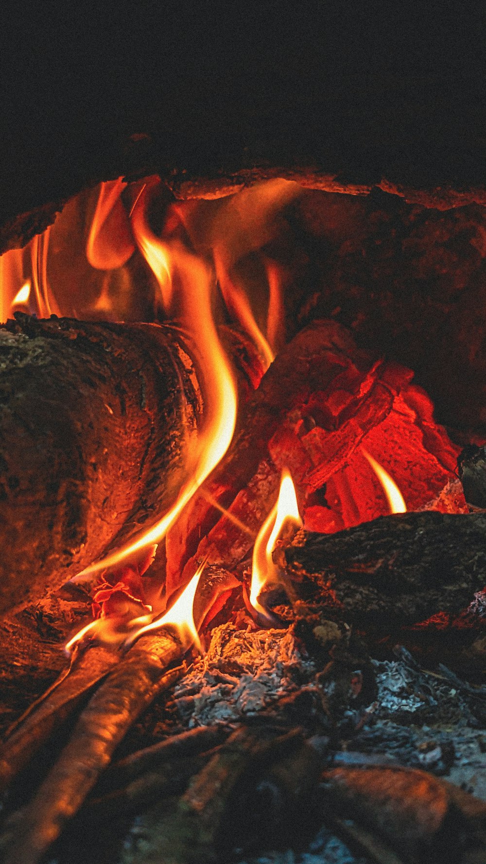 a close up of a fire burning in a fireplace