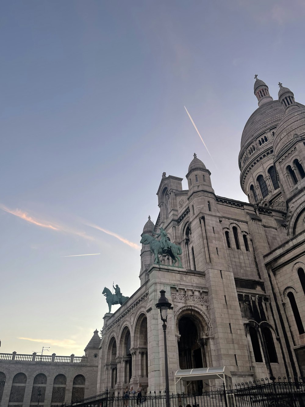 a large building with a statue of a horse on top of it