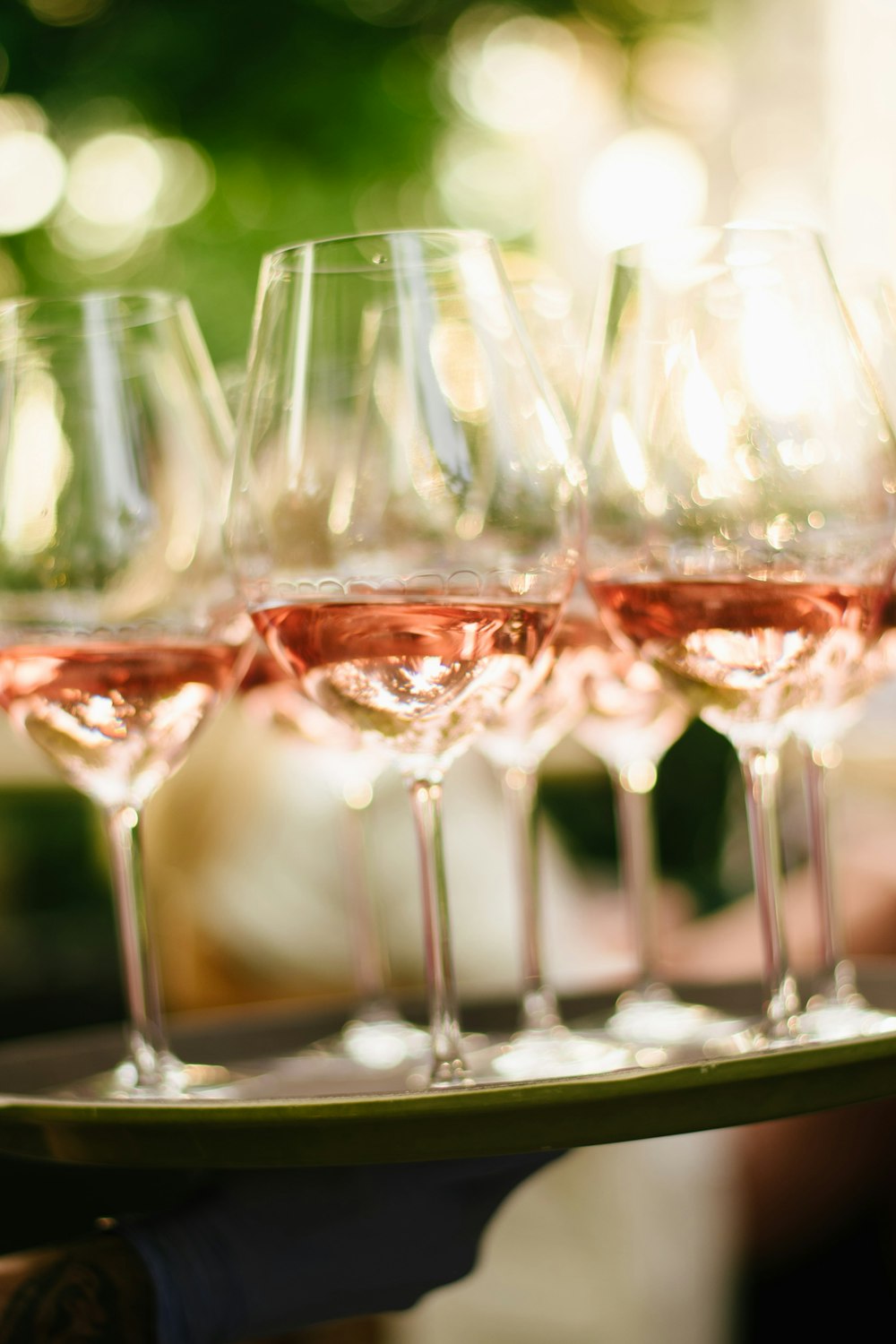 a tray of wine glasses sitting on top of a table