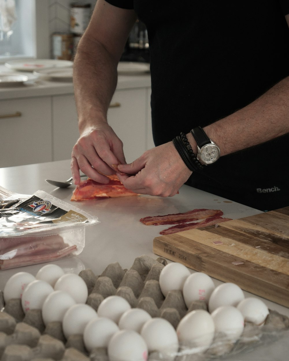 a man is cutting up eggs on a counter