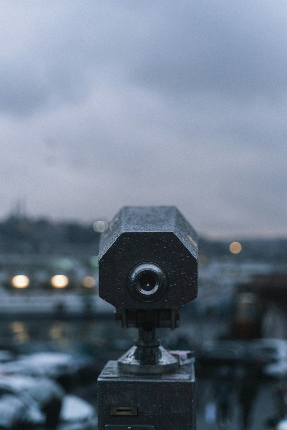 a close up of a camera on top of a building