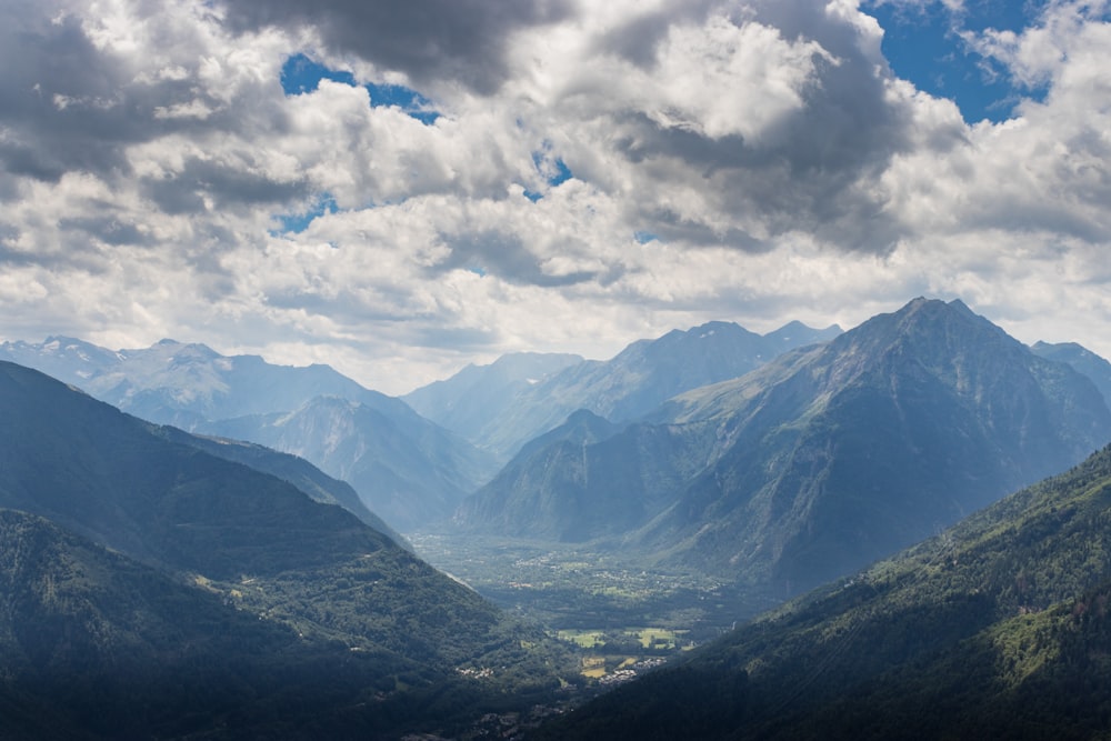 a view of a valley with mountains in the background