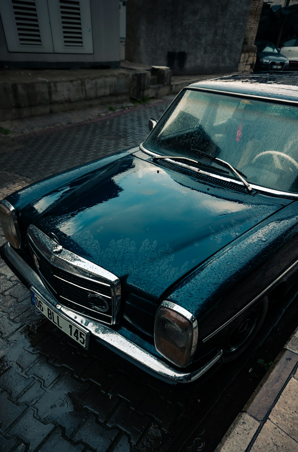 a black car parked on the side of the road