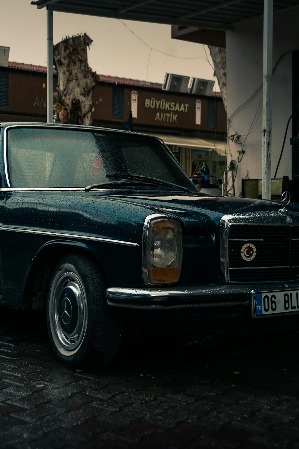 a black car parked in front of a building