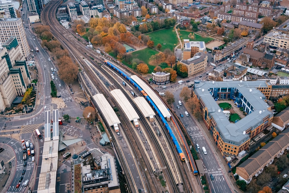 an aerial view of a train station in a city