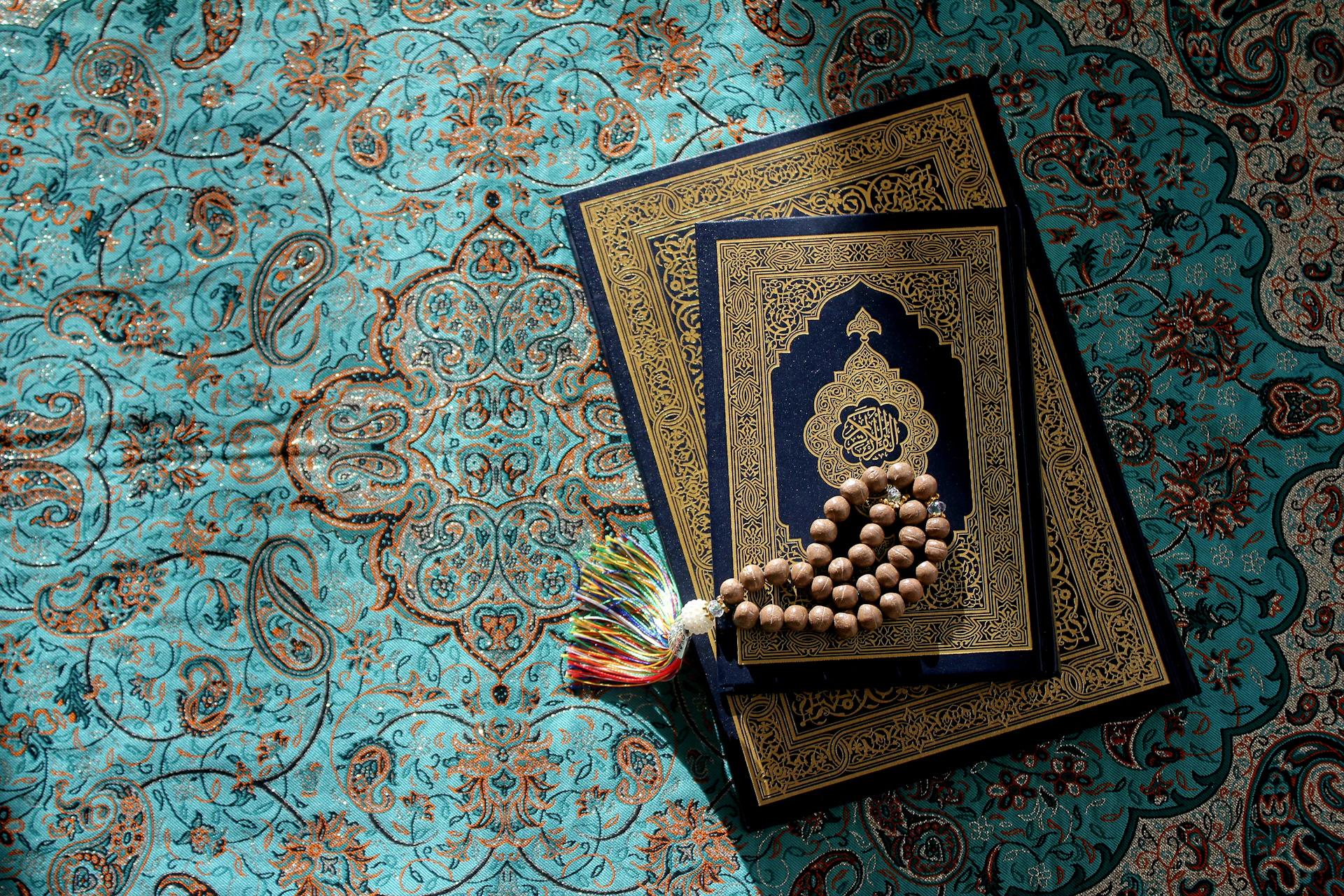 a rosary laying on top of a book