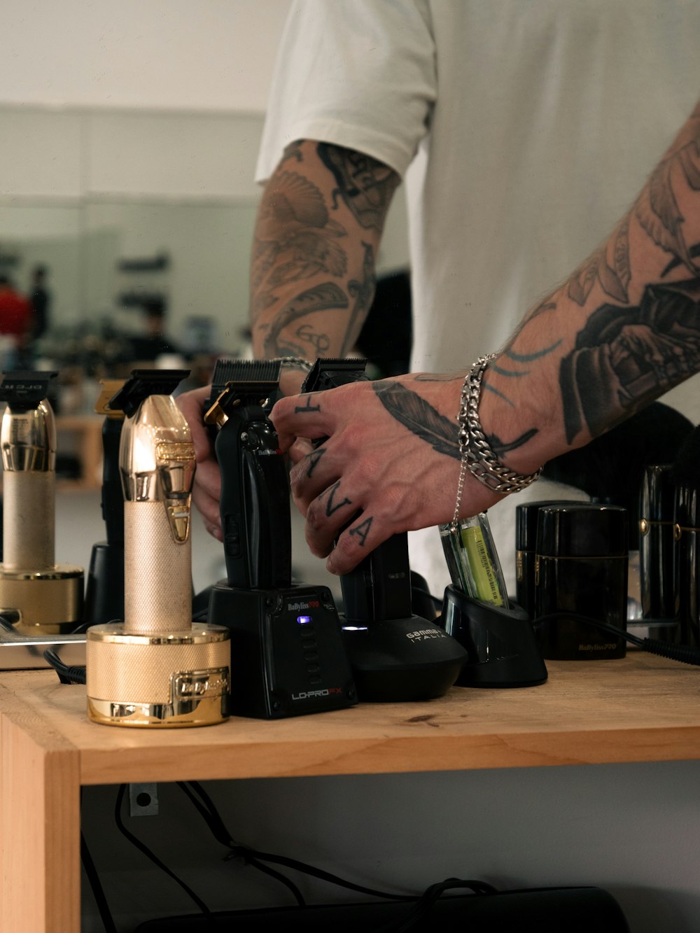 a man with a tattoo on his arm working on a machine