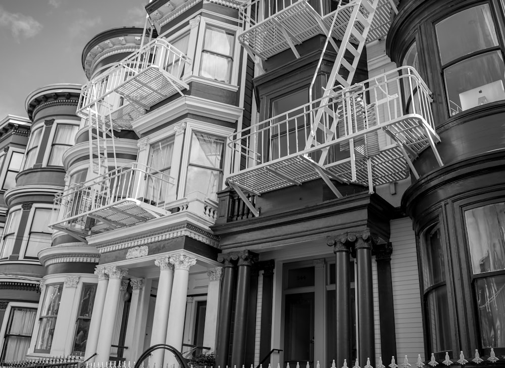 a black and white photo of a row of houses