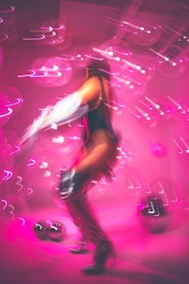 a person on a skateboard in a room with neon lights