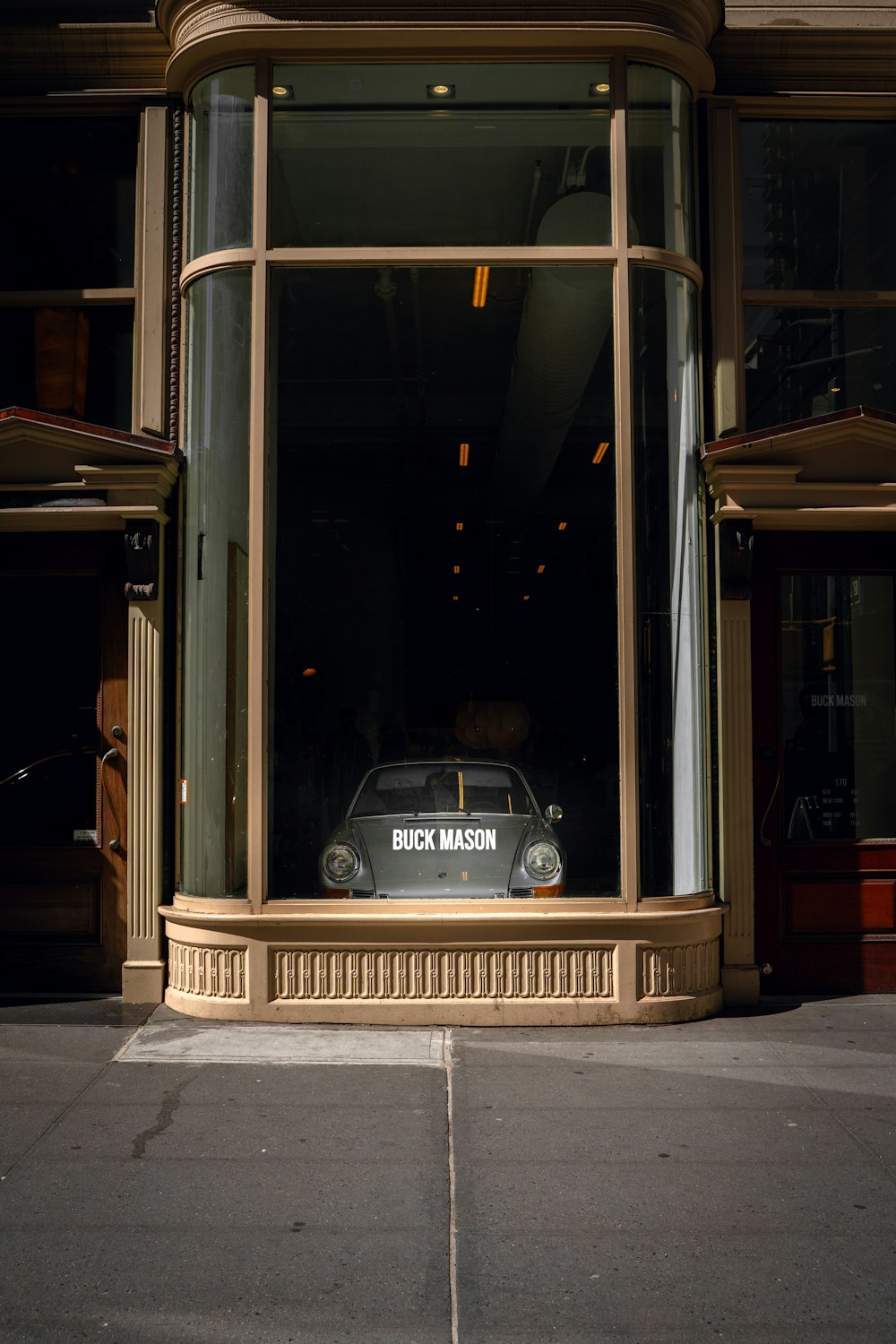 a car parked in front of a store window