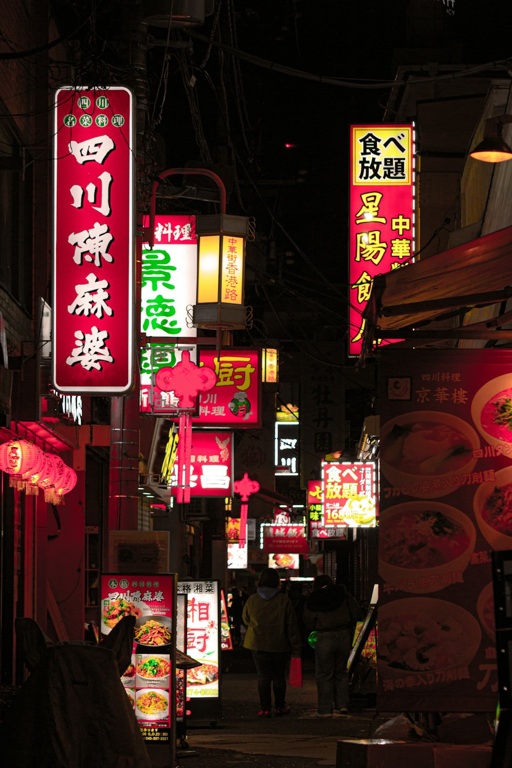 a city street filled with lots of neon signs