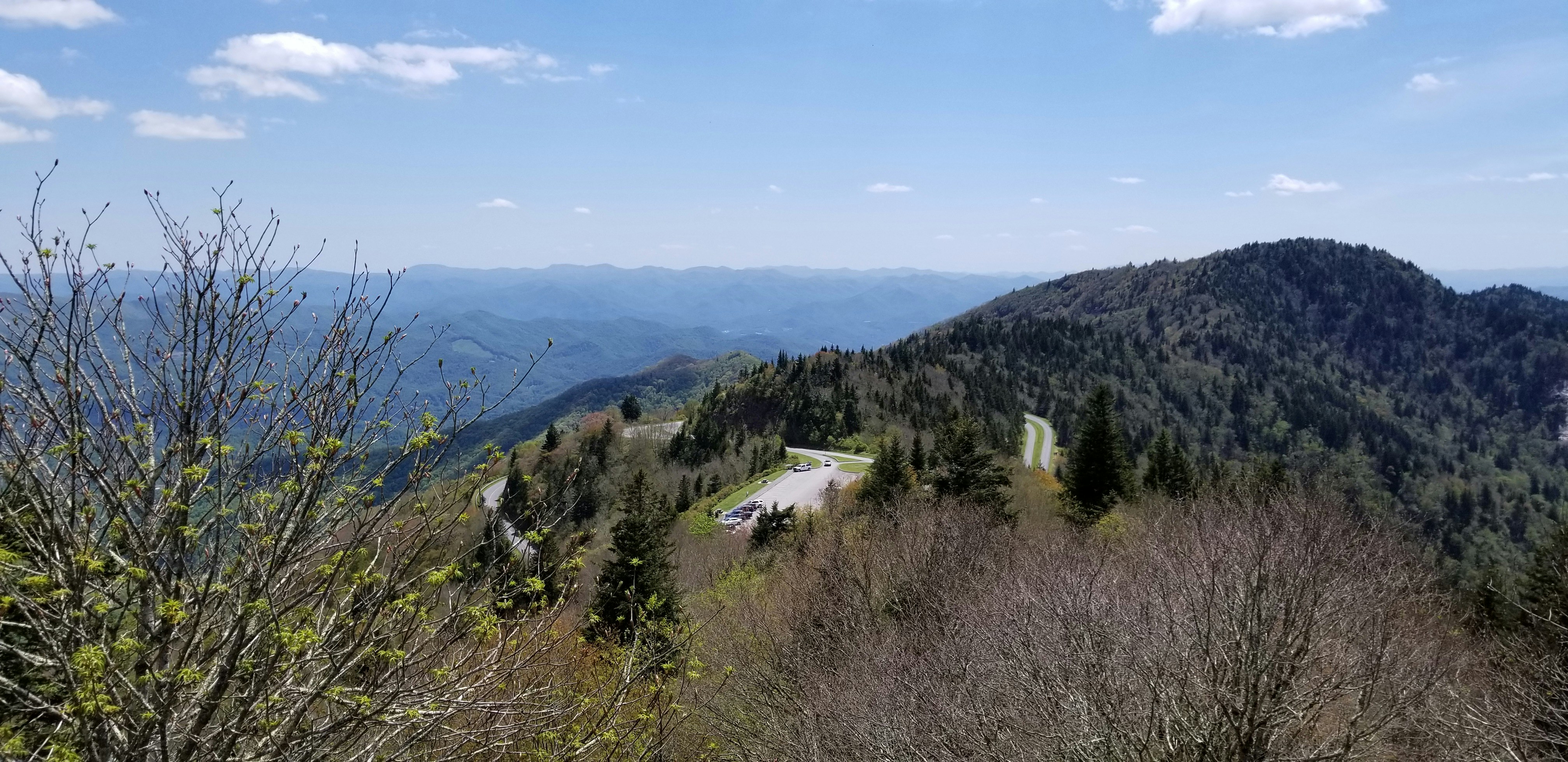 a scenic view of a road in the mountains