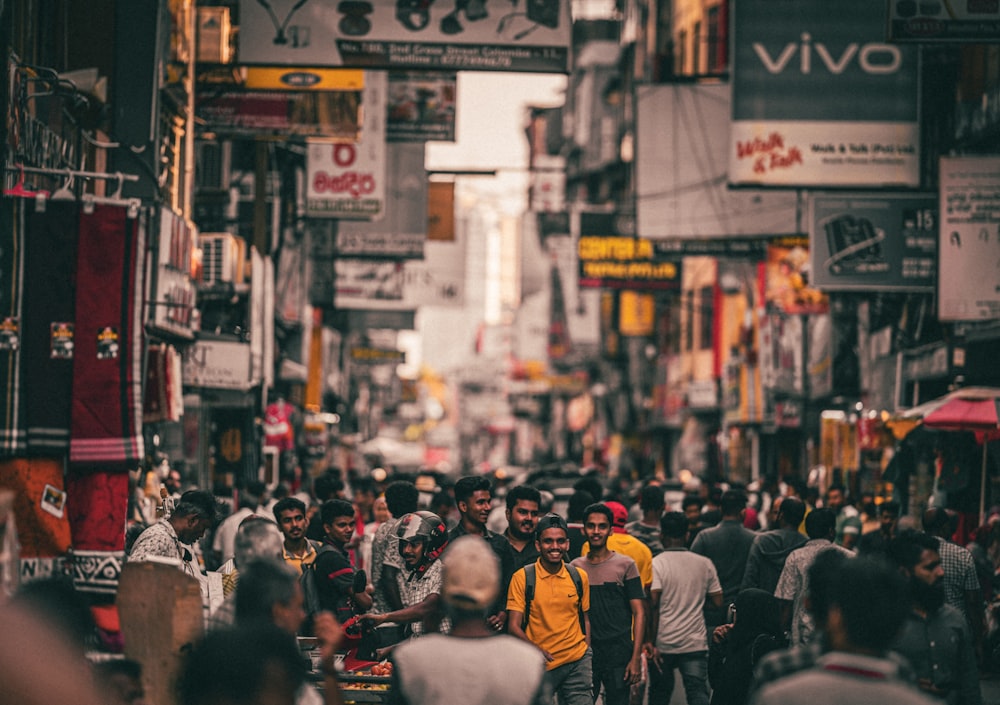 a group of people walking down a crowded street
