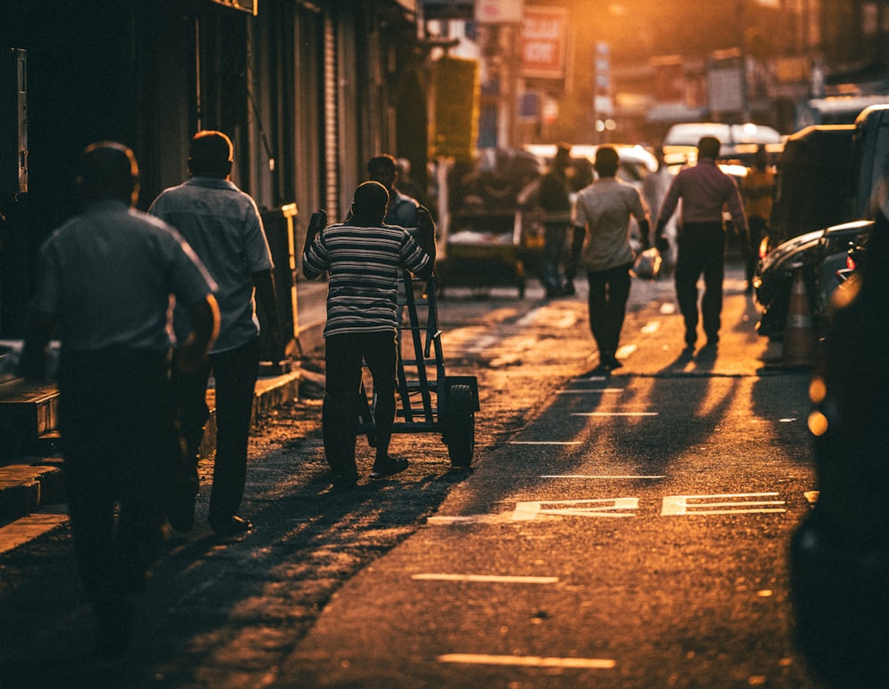 a group of people walking down a street