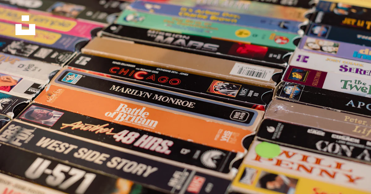 A bunch of different types of dvds on a table photo – Free Human Image ...