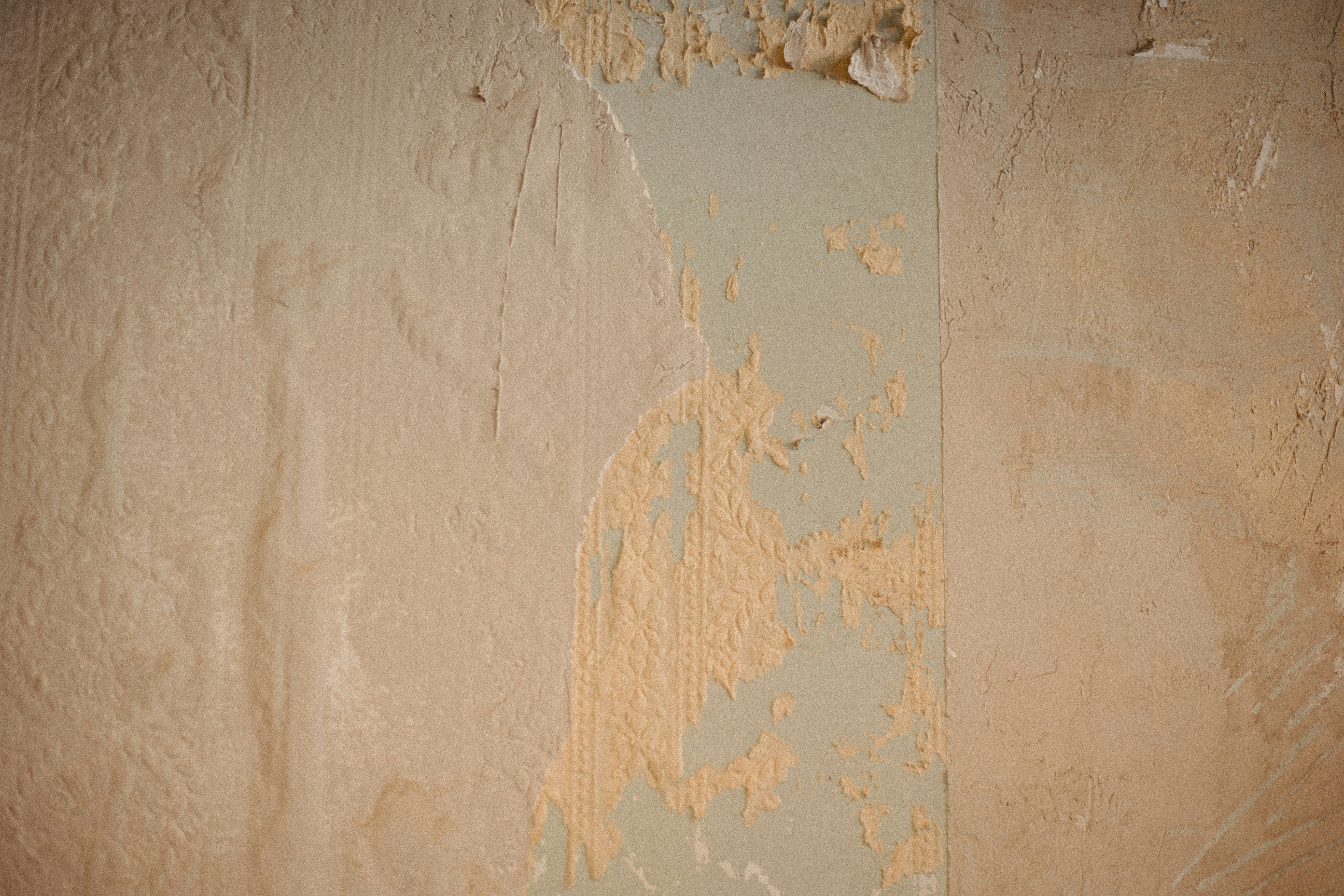 a wall with peeling paint on it