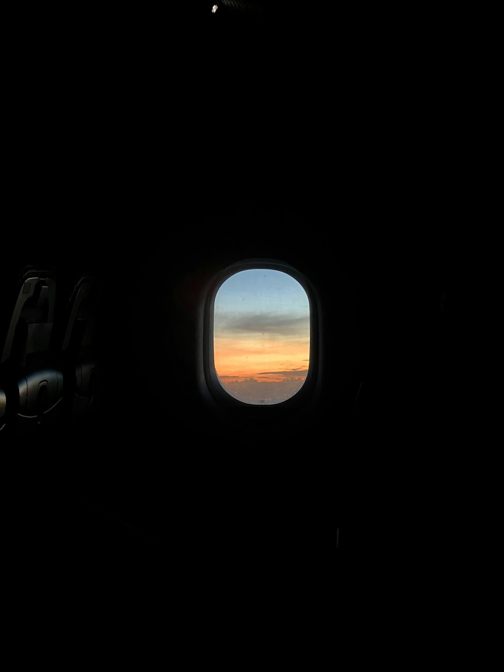 a view of a sunset through an airplane window