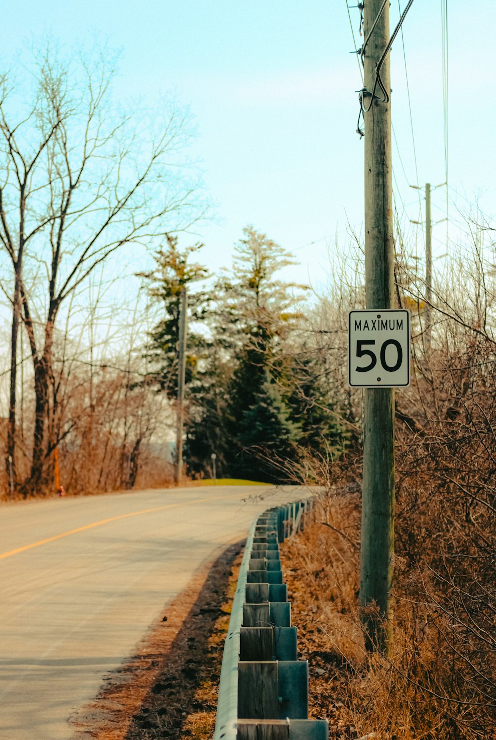 a speed limit sign on the side of a road