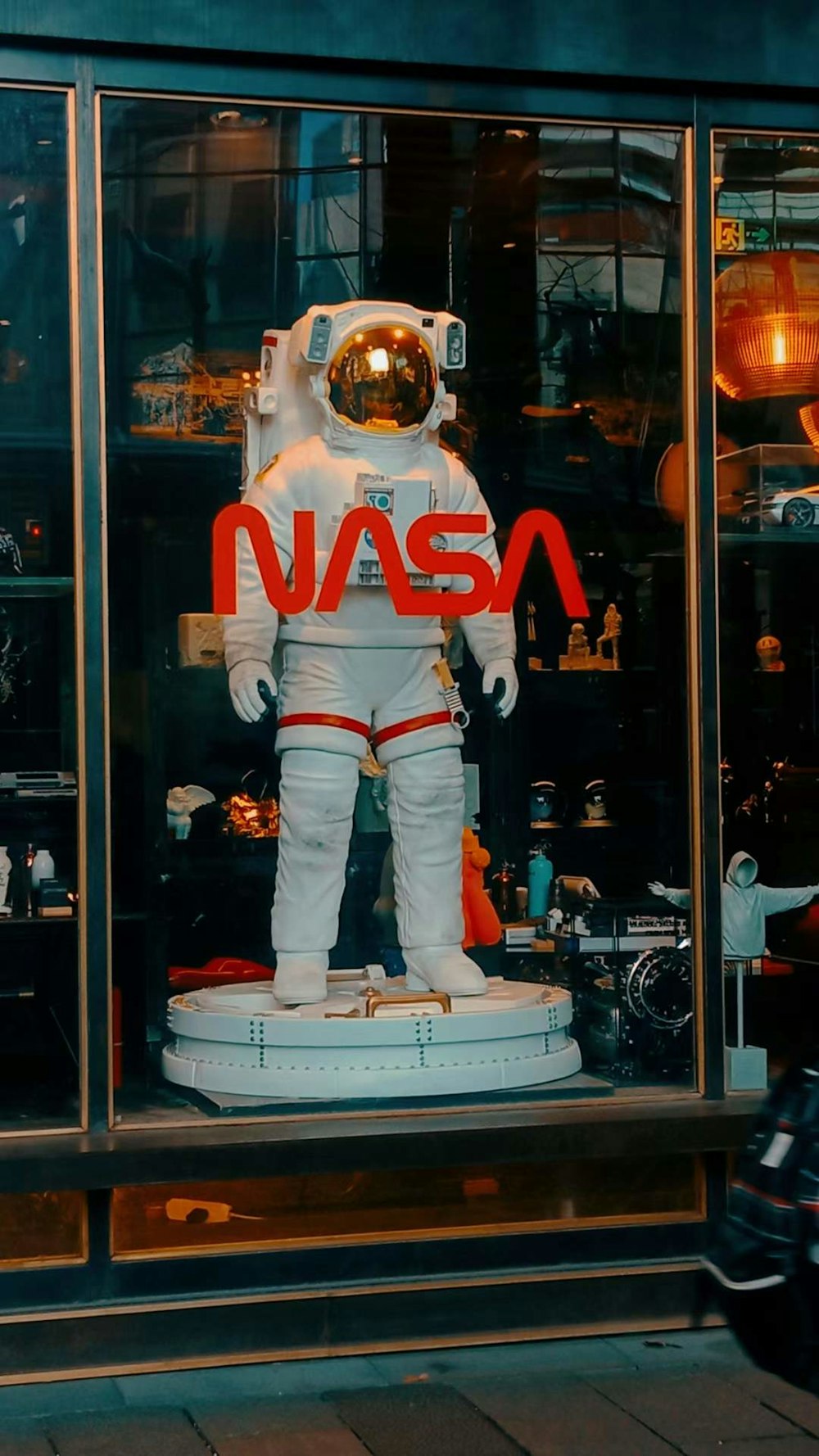 a window display of a nasa suit and helmet