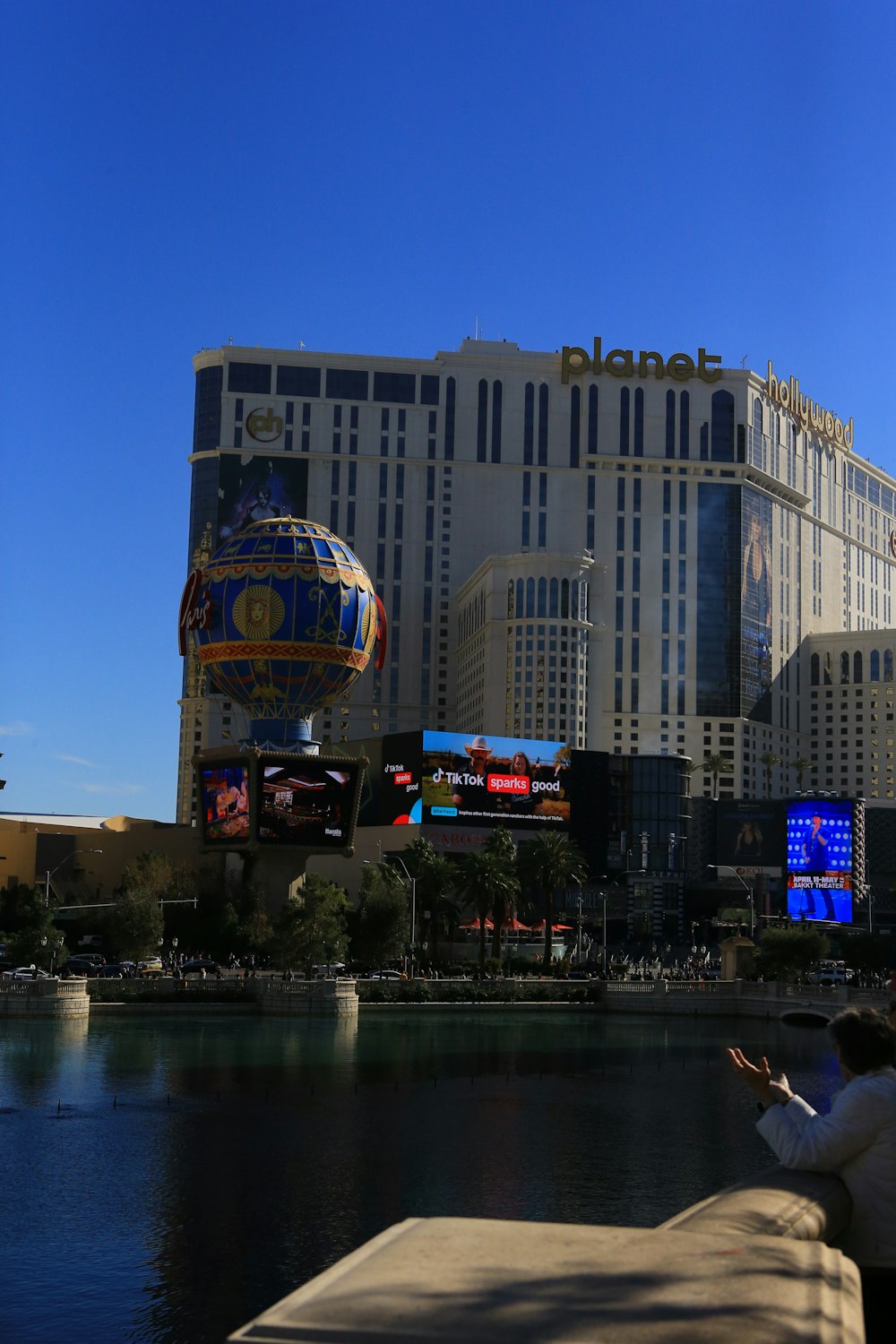 a man taking a picture of a large building