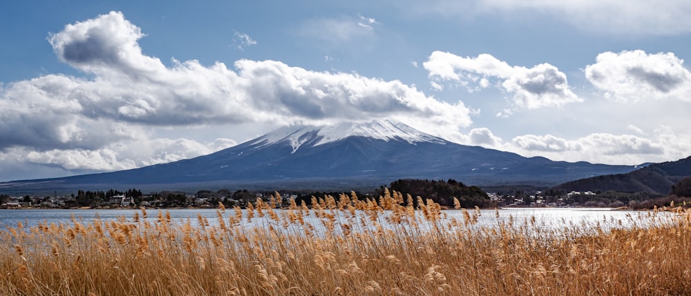 a view of a mountain with a lake in the foreground