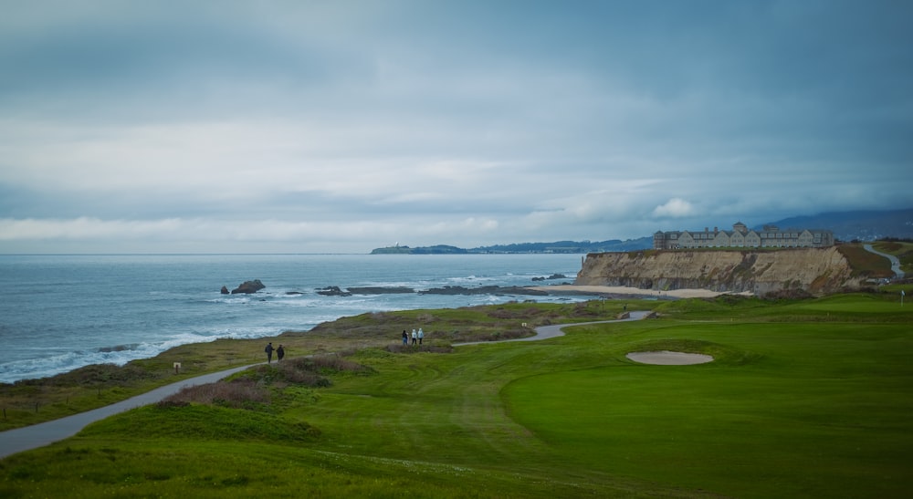 a golf course with a view of the ocean