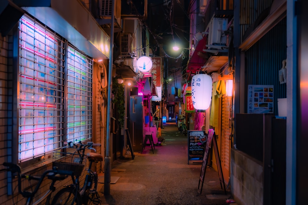 a narrow alley way with a bicycle parked on the side