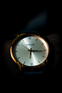 a close up of a watch on a person's wrist