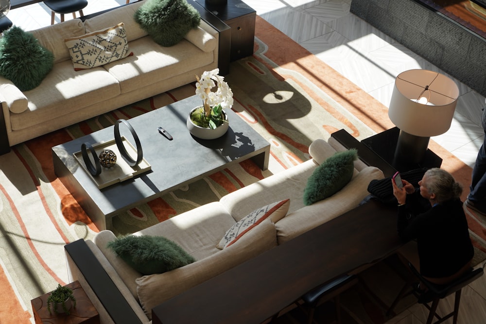 a living room filled with furniture and a large window