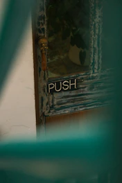 a close up of a door with a push sign on it