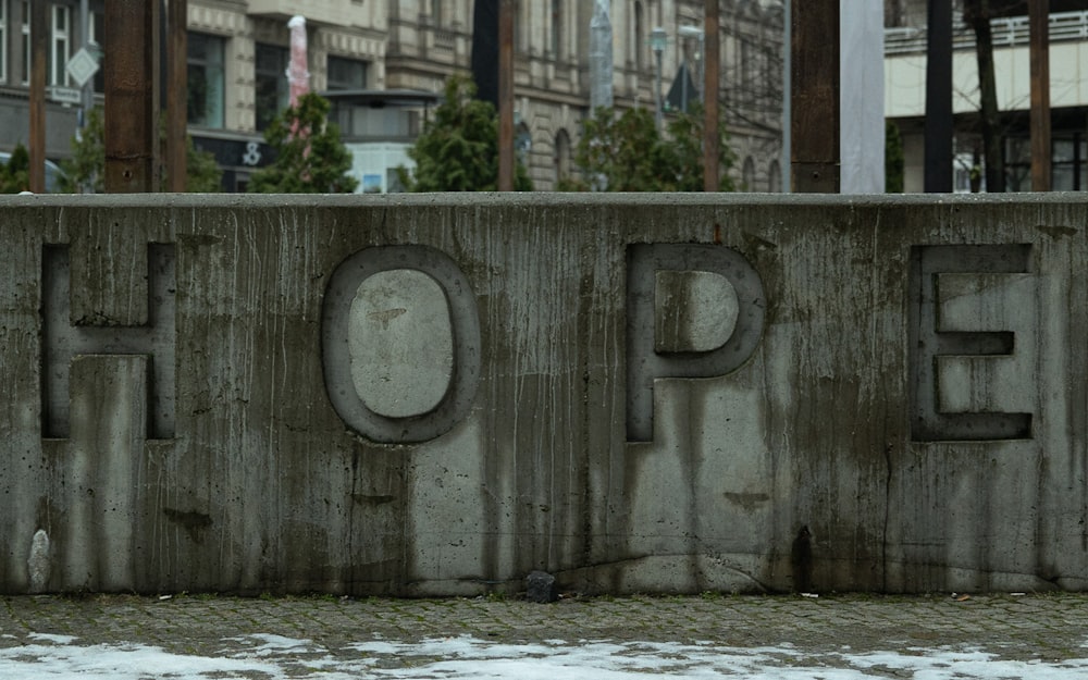 a concrete wall with the word hope written on it