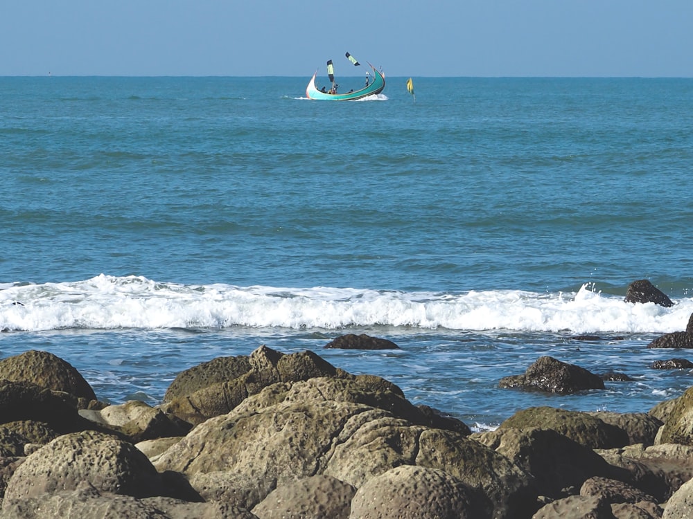 a boat is out in the ocean on a sunny day