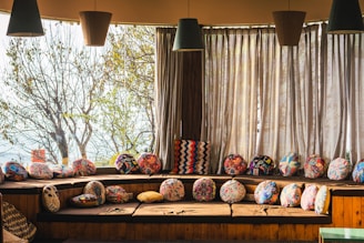 a room with a lot of pillows on the floor