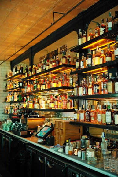 a restaurant back bar filled with lots of wine & spirit bottles.