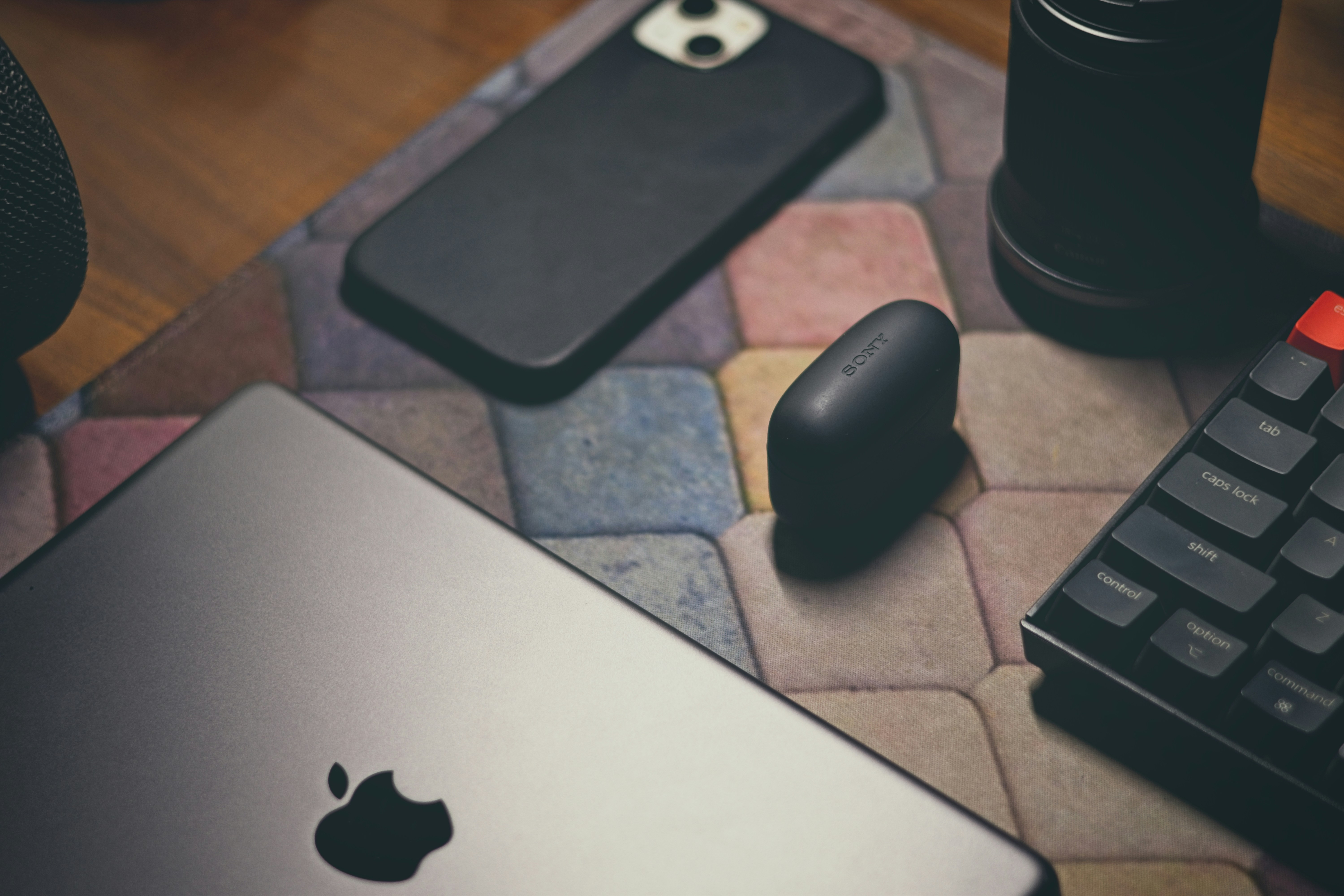 a laptop computer sitting on top of a table next to a keyboard