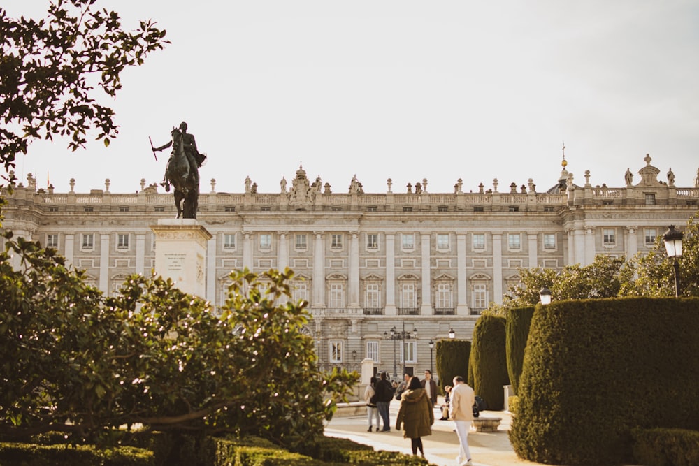 a large building with a statue on top of it