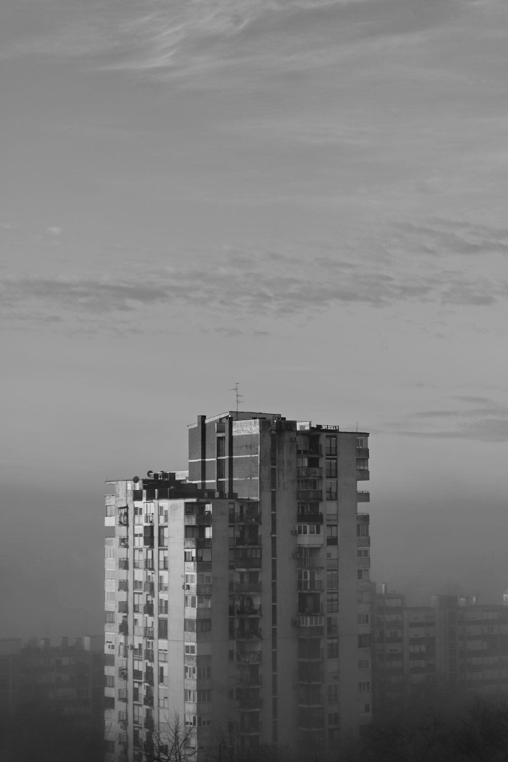 a black and white photo of tall buildings