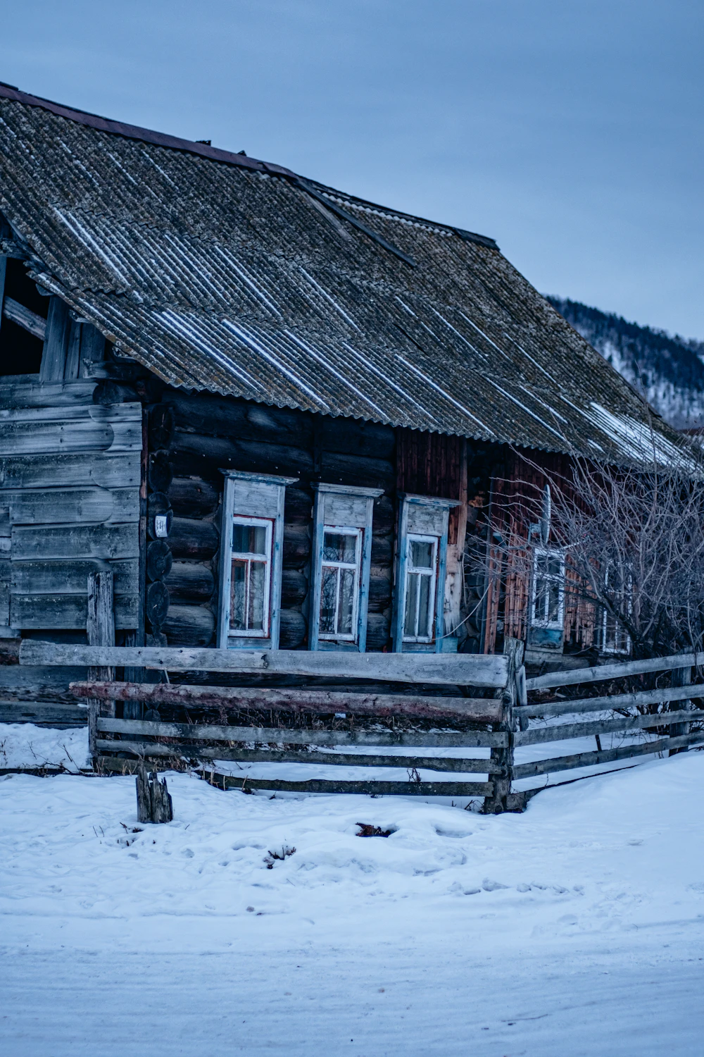 A cabin dusted in snow during a Manitoba winter