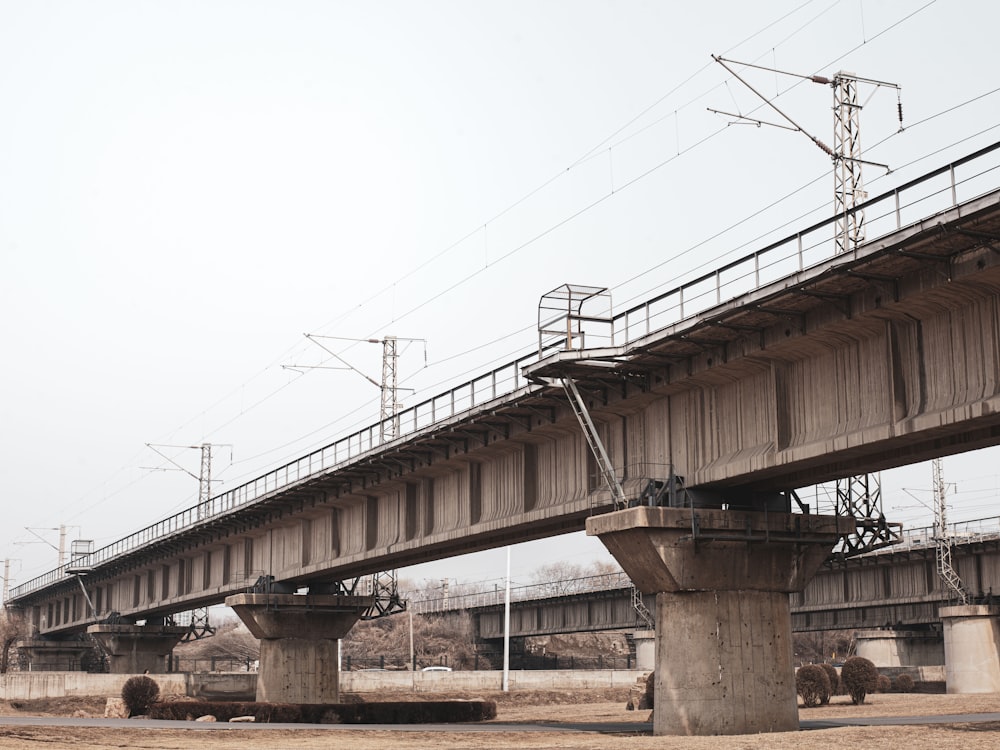 a train track going over a bridge over water