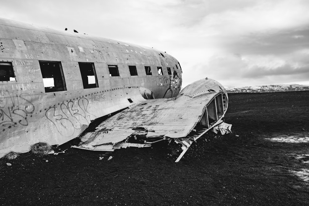 an old airplane with graffiti on the side of it