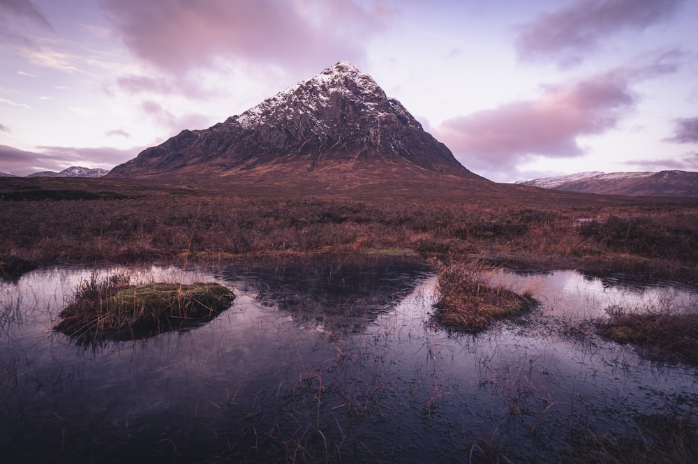 a mountain with a lake in front of it