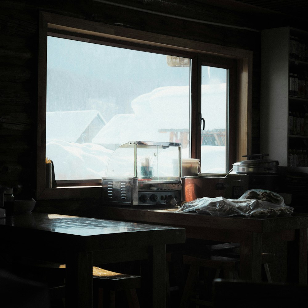 a kitchen with a table and a window