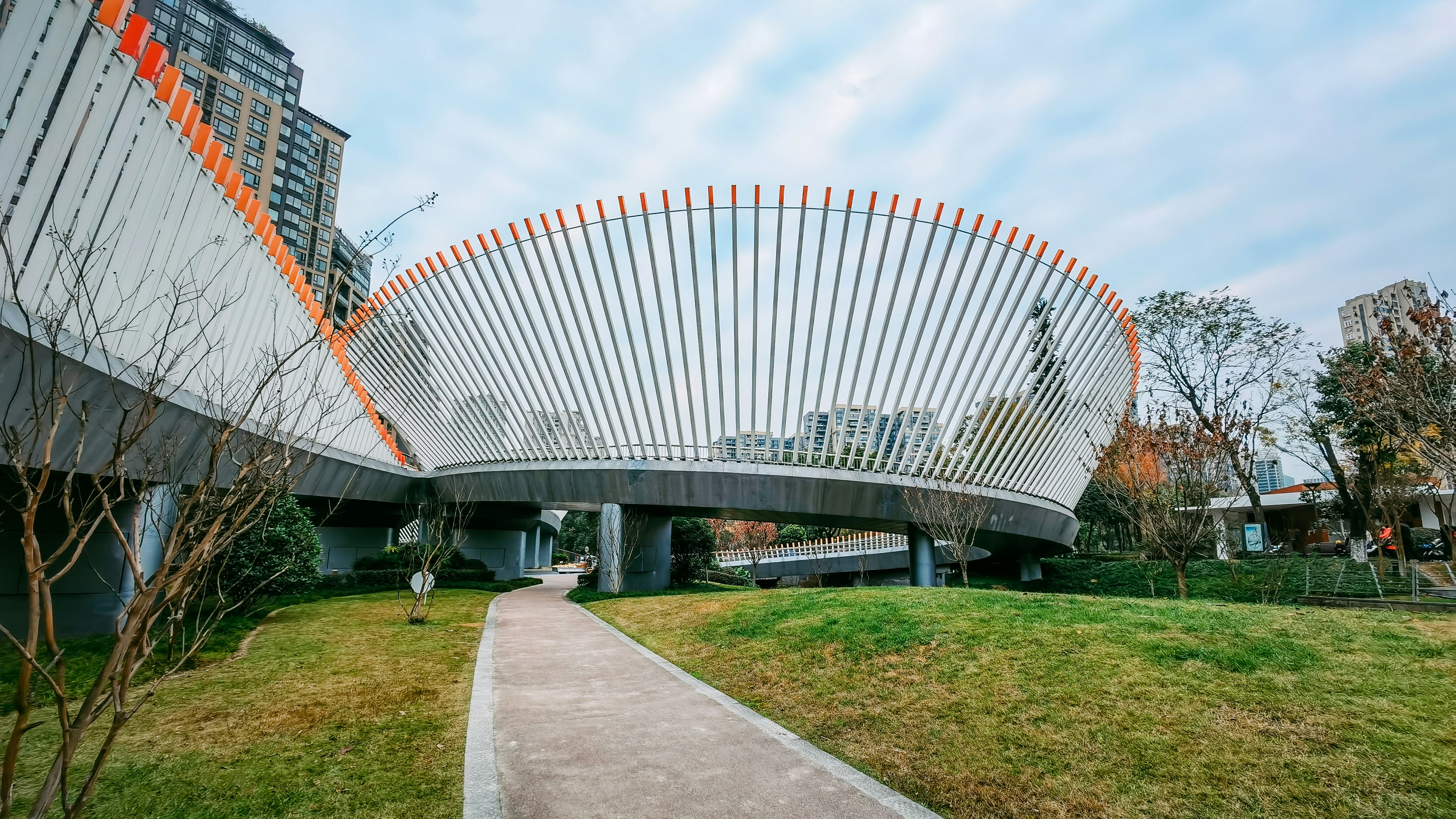 A curved walkway leads to a modern building photo – Free Phone ...