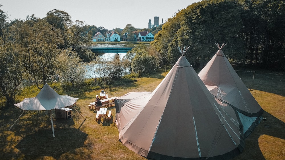 a group of tents sitting next to a river
