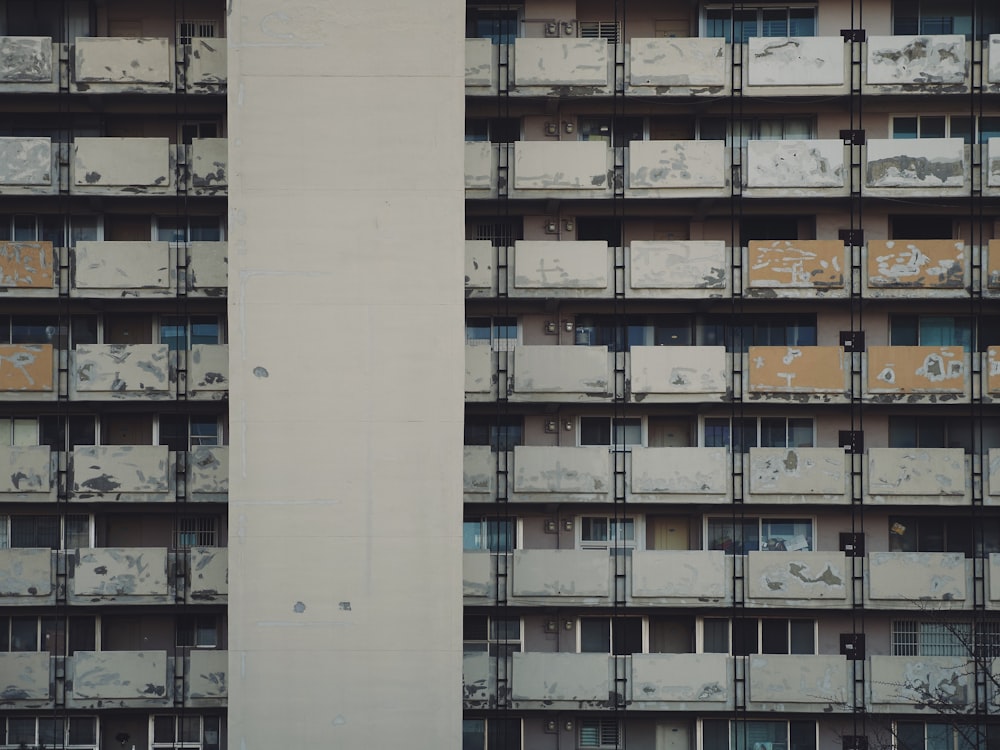 a very tall building with lots of balconies