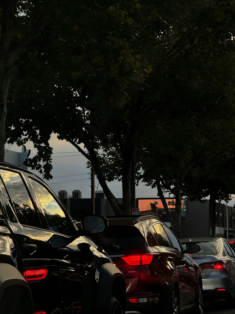 a row of parked cars on a city street