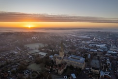 An aerial view of a city at sunset