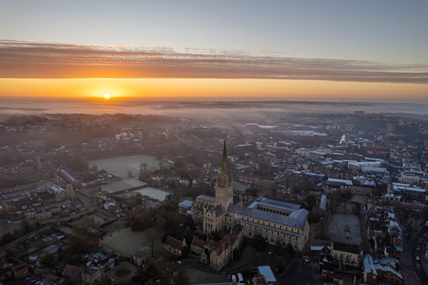An aerial view of a city at sunset