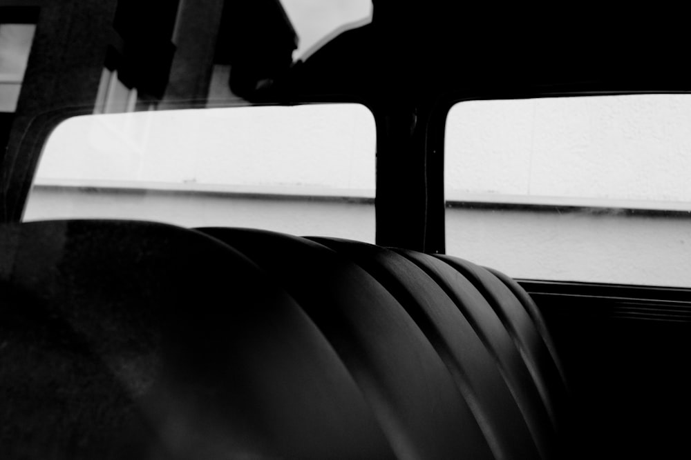 a black and white photo of the inside of a bus