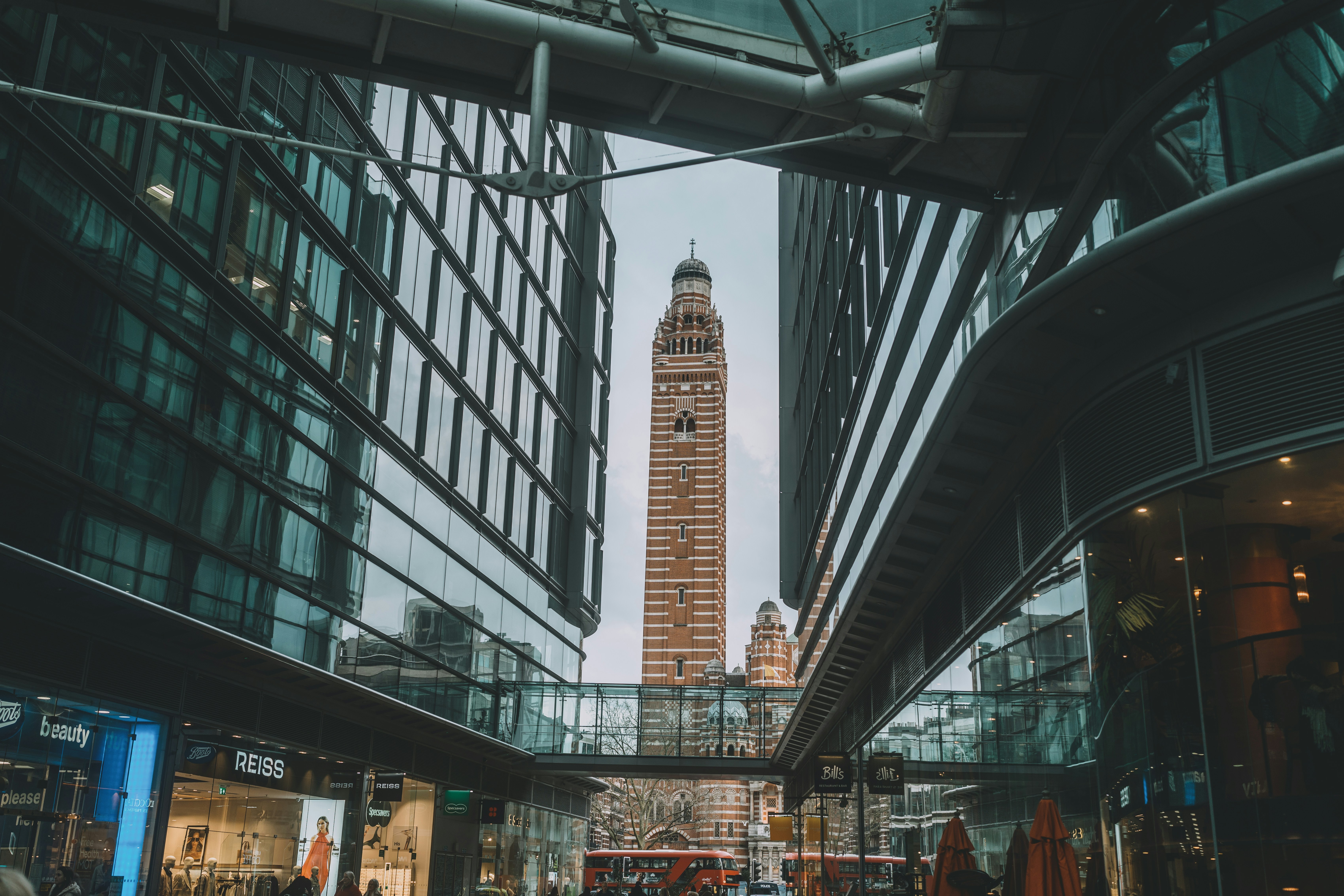 A tall clock tower towering over a city photo – Free Architecture Image ...